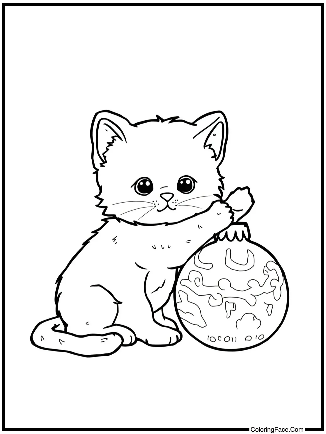 Kitten playing with ornament.